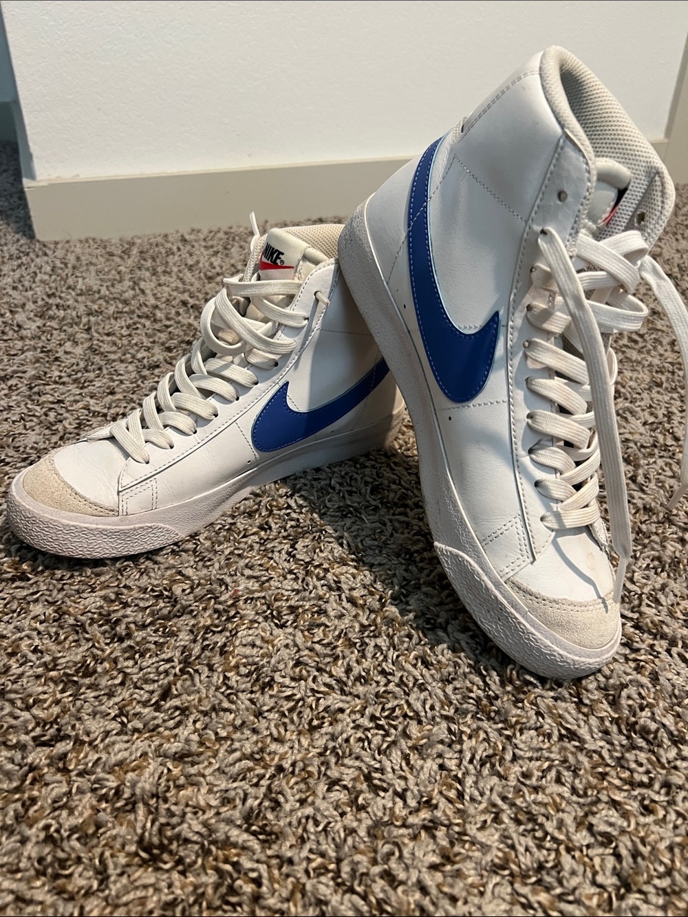 Nike White High-Top Sneakers with Blue and Red Swoosh